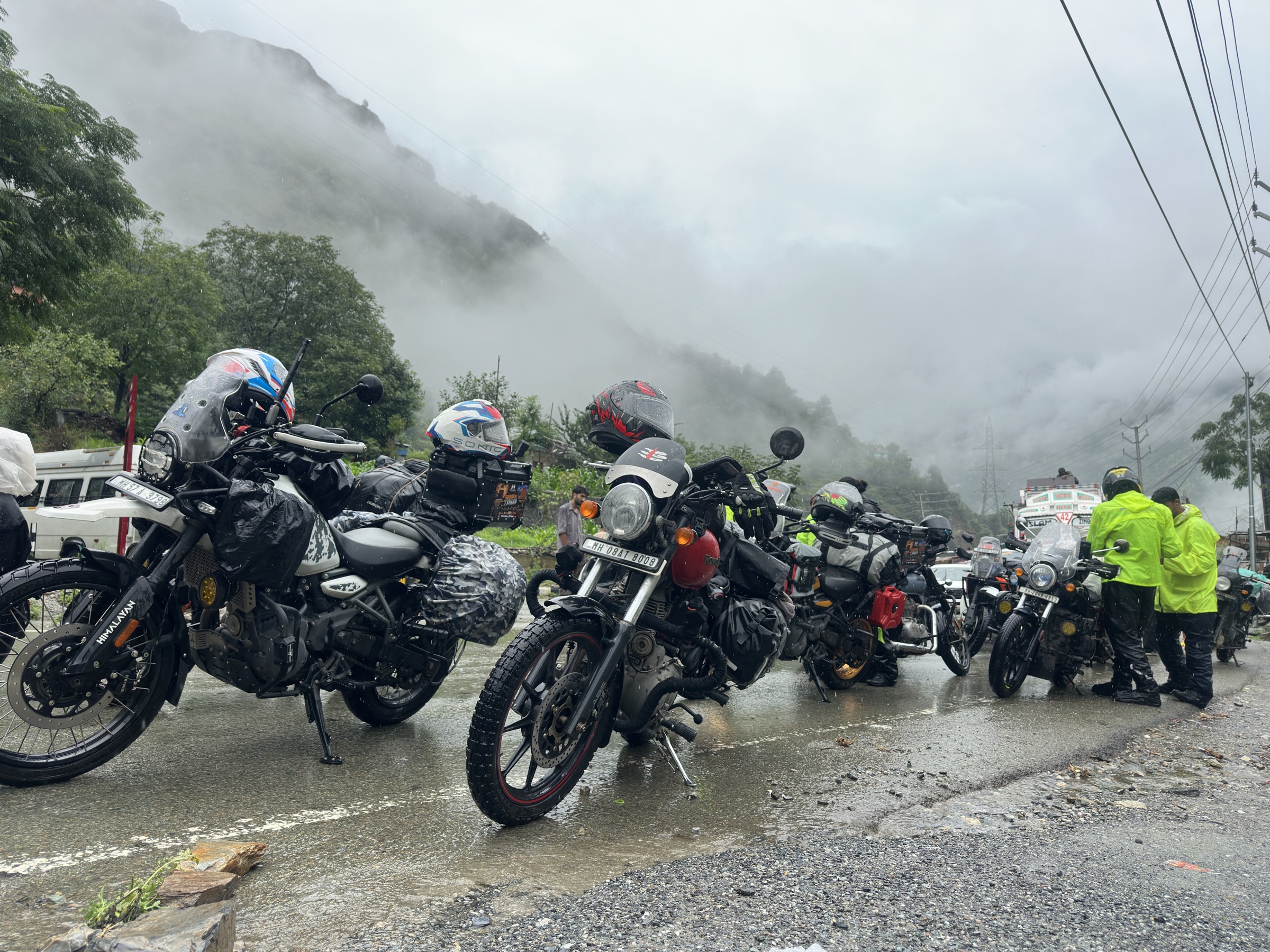 The Rydin convoy stopped on a foggy mountain road in the rain